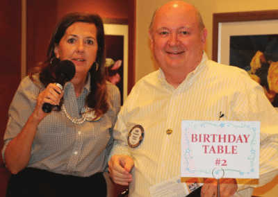 Bob Barnard is trying to be clever by not sitting at the birthday table. He deserves a fine.
