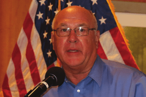 Bill Stieren introduces his friend an excellent singer to deliver our National Anthem.