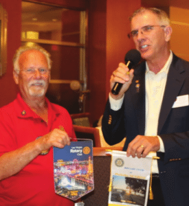 Bob Werner exchanges flags with our visiting Rotarian.