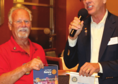 Bob Werner exchanges flags with our visiting Rotarian.