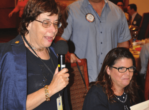 Visiting Rotarian Kathy Mahon enjoys fellowship with Katie Decker.