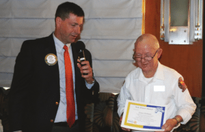 President Dave presents our speaker Ernest Williams with the Sole Power Award.