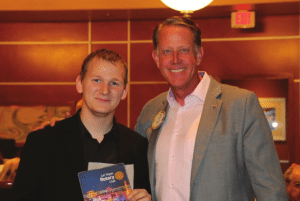 Russ Swain exchanges Banners with an international guest from Germany.