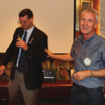 Past President Tom Thomas receives a recognition award from