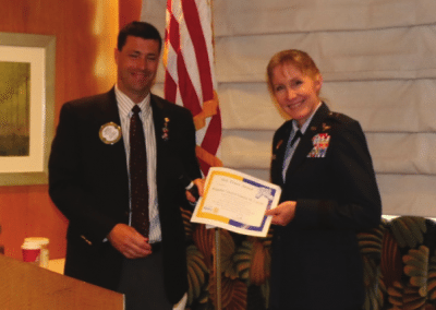 President Dave presents our speaker Brigadier General Jeannie M. Leavitt the commander of the 57th Wing at Nellis AFB.