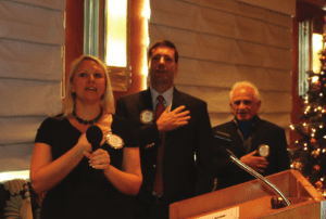 Jaime Goldsmith, President Dave and Jerry led the club in song.