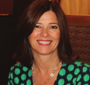 Past President Ginger Anderson explained about the next Breakfast with Books