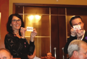 Greg Devereaux plays a clever card trick with Rosalee Hedricks.