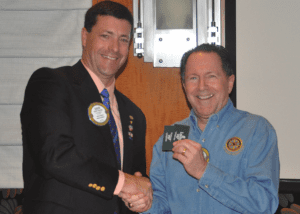 Dave Thorson presents Lawry Bucks to Steve Linder.