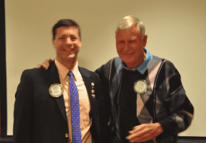 Dave Thorson gives Paul Harris +4 award to Lloyd Sauter.