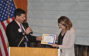 Dave Thorson presents Sole Power Award to Chelsea Seegers.