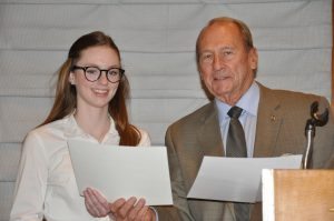 Brock Fraser presents third place award