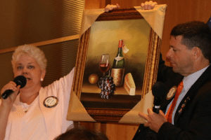 Janice Lencke showed one of the raffle prizes for the Car Show.