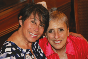 Nancy Slitz is moving to Colorado and poses with Janet Linder for a going away photo.
