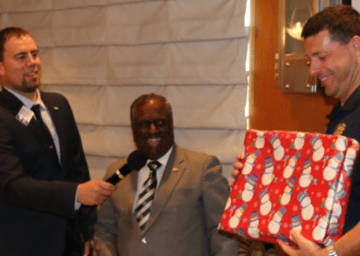 PDG Rampur gives a present (a leather briefcase) to PP Dave Thorson.