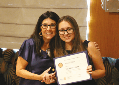 Francesca Gilbert awards her daughter Alyssa with her first Paul Harris Fellowship.