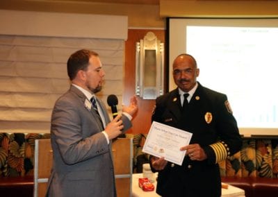 President Michael presents our speaker LVFR Chief Willie McDonald with our Share What You Can award