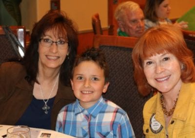 Luanne Wagner and her grandson Mathew and his godmother Arleen Sirois pose for a picture.