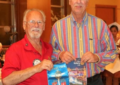 Bob Werner exchanged Banners with our Rotarian guest from France.