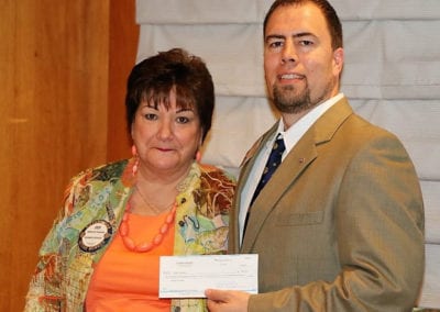 Deb Granda presented her check and other member checks totaling $6,500 in memory of her deceased husband Bill.