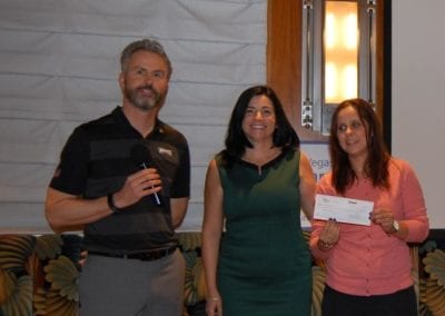 President Jim Kohl and Jennifer Carlson presented a $5K check to Kim Gradisher for the Tyler Robinson Foundation.