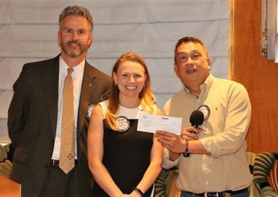 President Jim and Melanie Muldowney presented a check to Mike Cudiamat to be used in a medical Clinic in the Philippines.