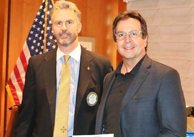 President Jim presented Mark Brown with a check on behalf of Las Vegas Rotary and Howard and Howard.