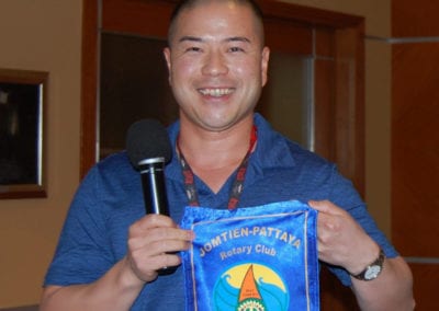 Chan Lam presenting a Banner from Jomtien-Pattaya ThailandRotary Club.