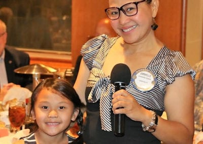 Jimmelle and her daughter pose for a picture while mom makes her announcements.