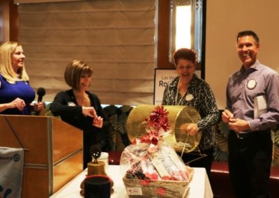 President Jackie, Toni Kern and Janet Lencke congratulated Dan Adamson on winning our raffle.