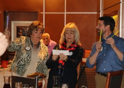 At PP Jackie's head table were Deb Granda, Rose Falocco and Bill Houghton holding their light sticks and joining in song.