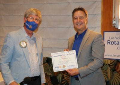 Bo Bernhard receives a Share What You Can award