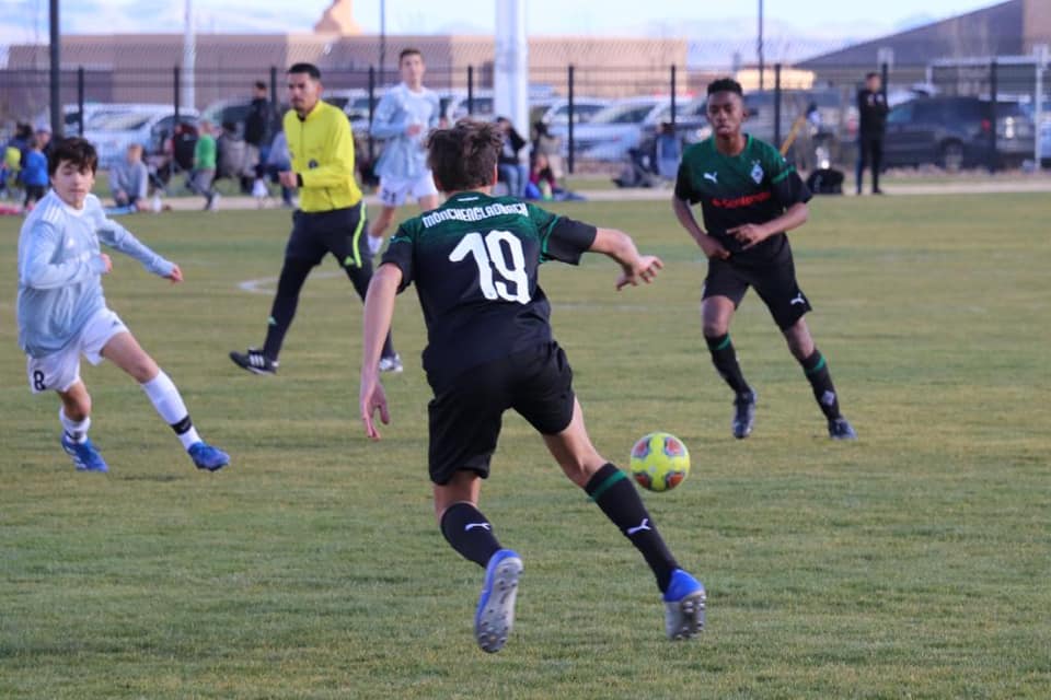 Players kicking a soccer ball at the Las Vegas Mayor's Cup