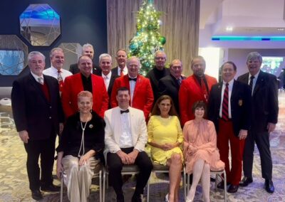 Rotary Holiday party group of current and past presidents pose for a picture